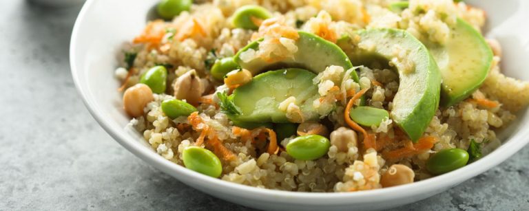 Spring power bowl with quinoa, avocado, edamame, cucumber and radishes for healthy energy